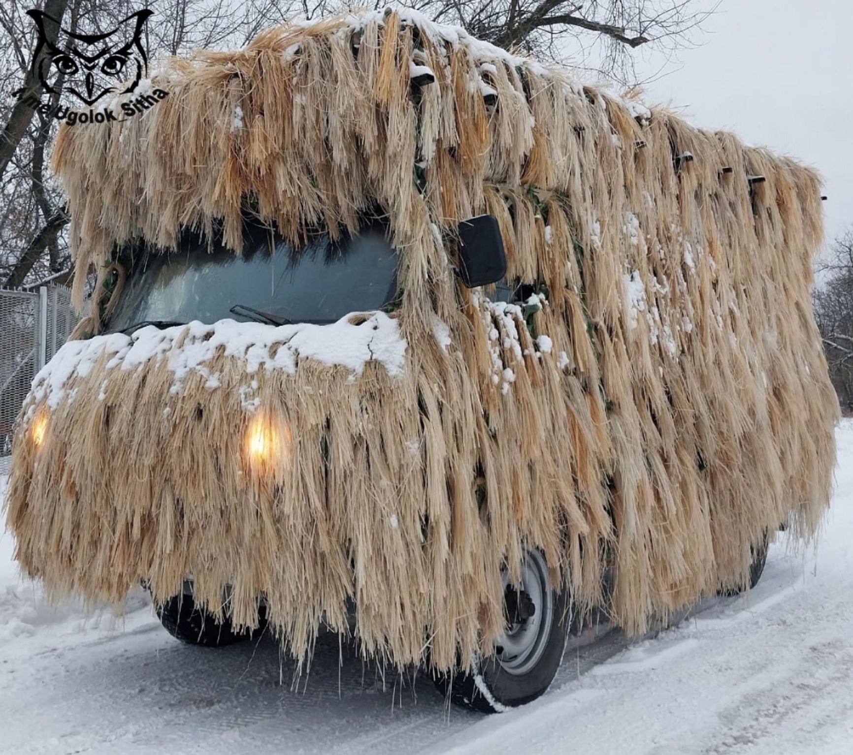 A Russian "bukhanka" (UAZ-469) in full camouflage gear, December 2023