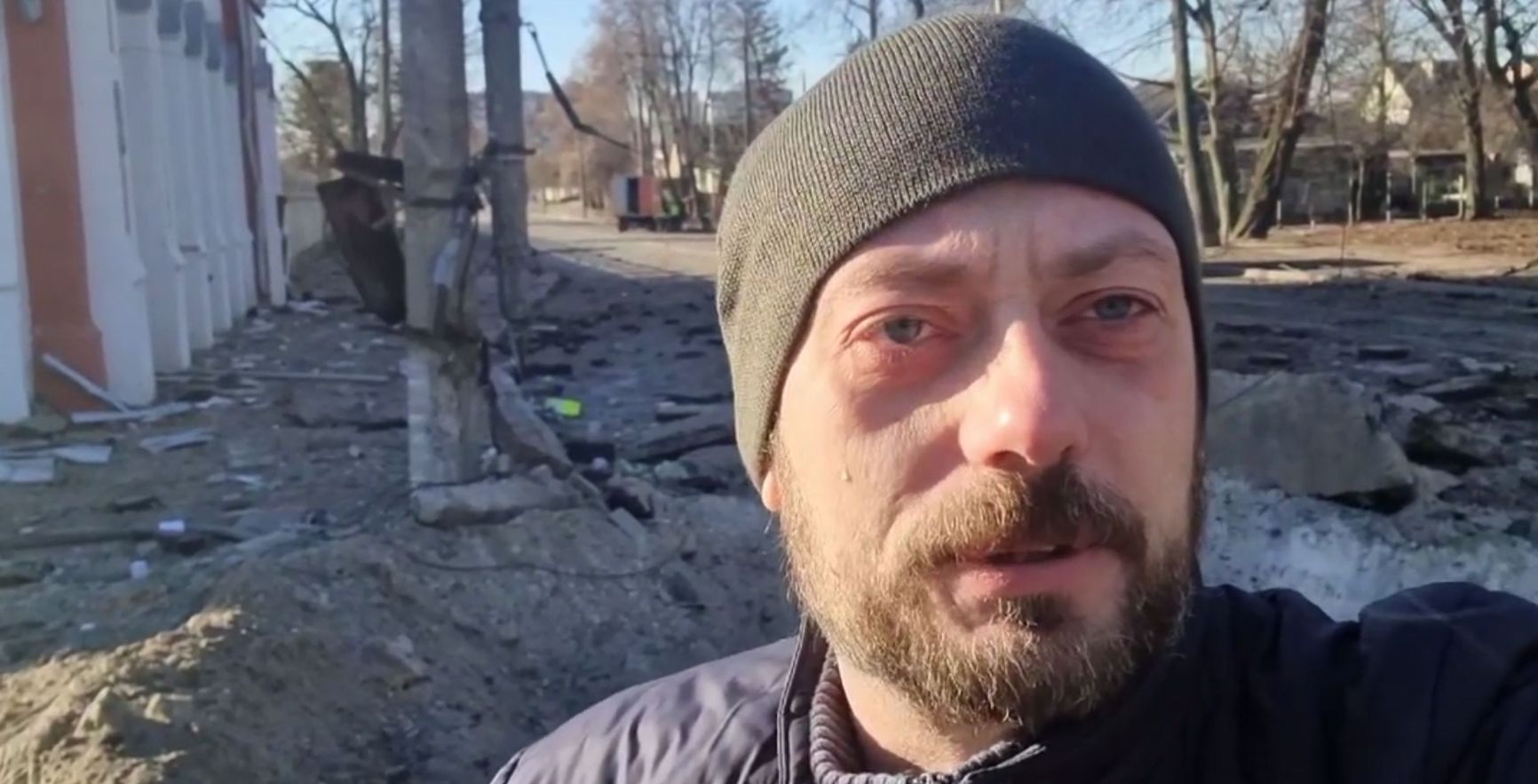 Vyacheslav Chaus near the crater in front of the library